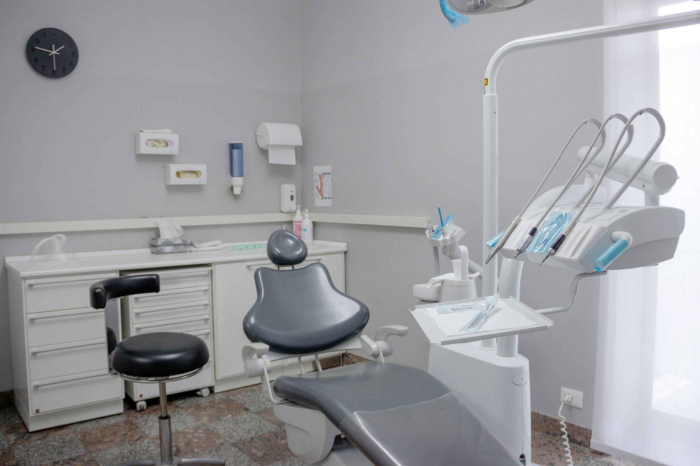 Dental operatory with the chair, instrument tray and cabinets cleaned and disinfected