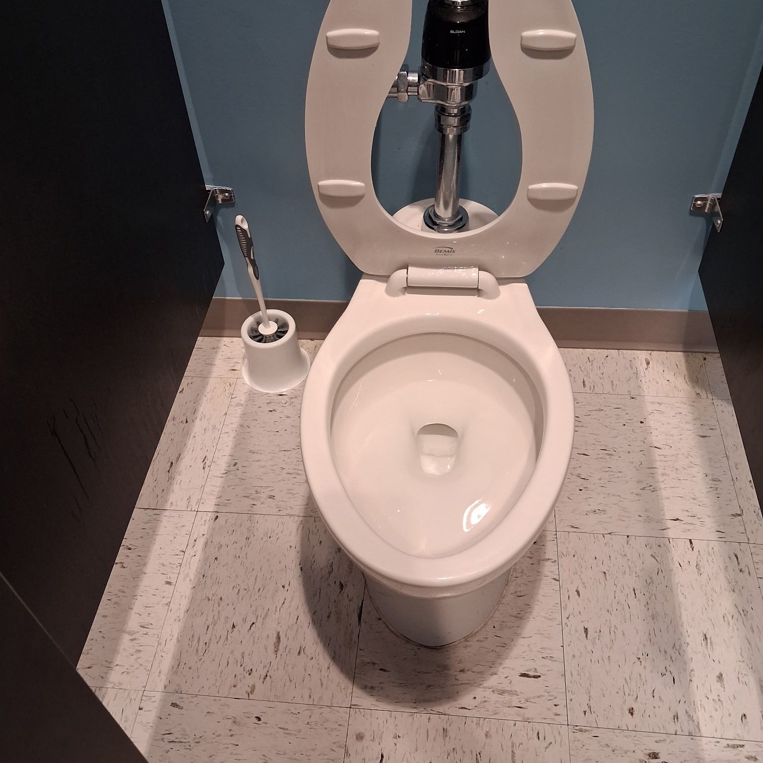 Commercial restroom toilet cleaned and disinfected on a recurring visit