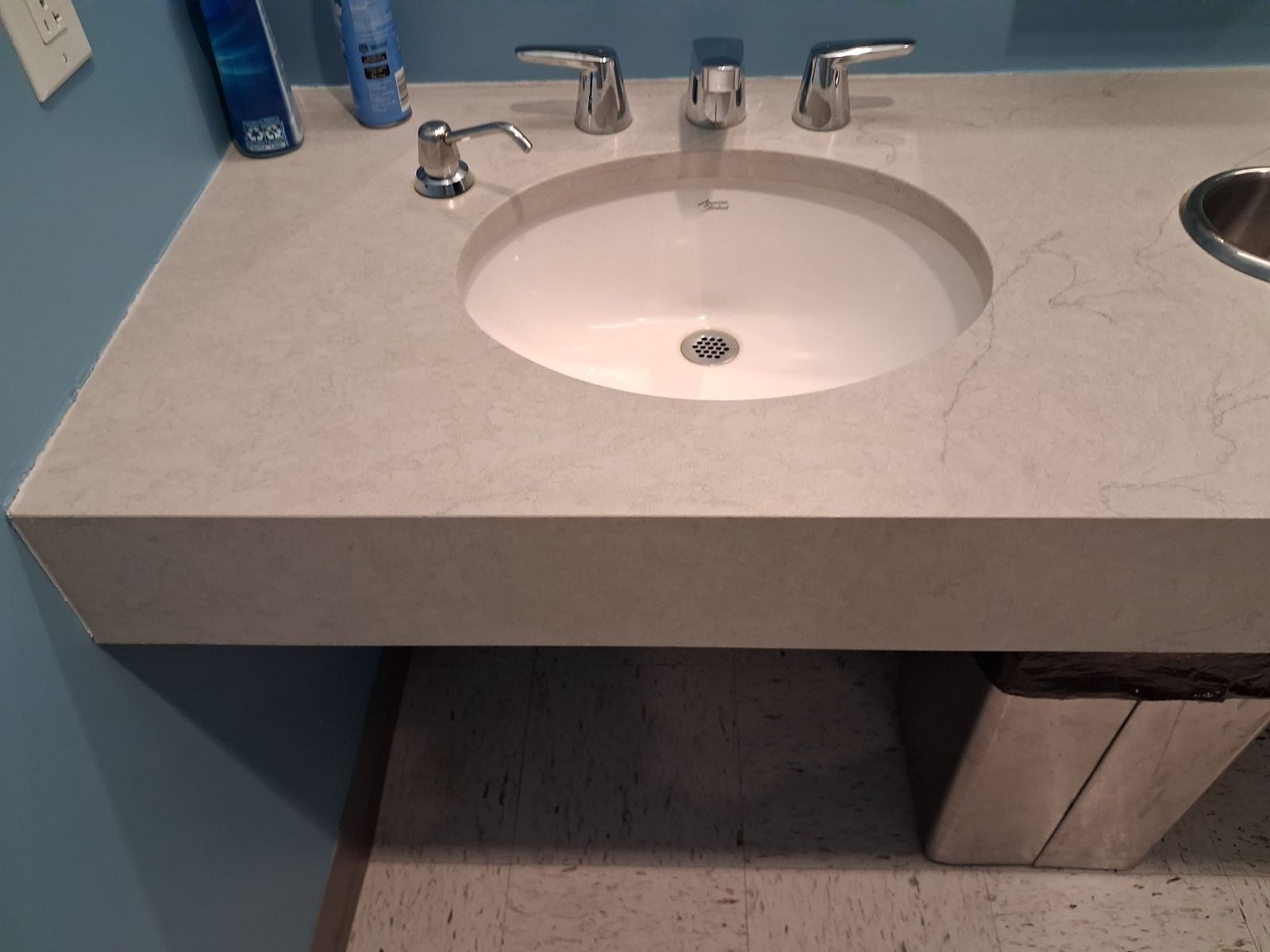 Restroom counter and basin wiped down during a scheduled visit